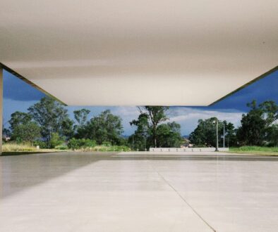 An empty concrete floor that looks out over a park